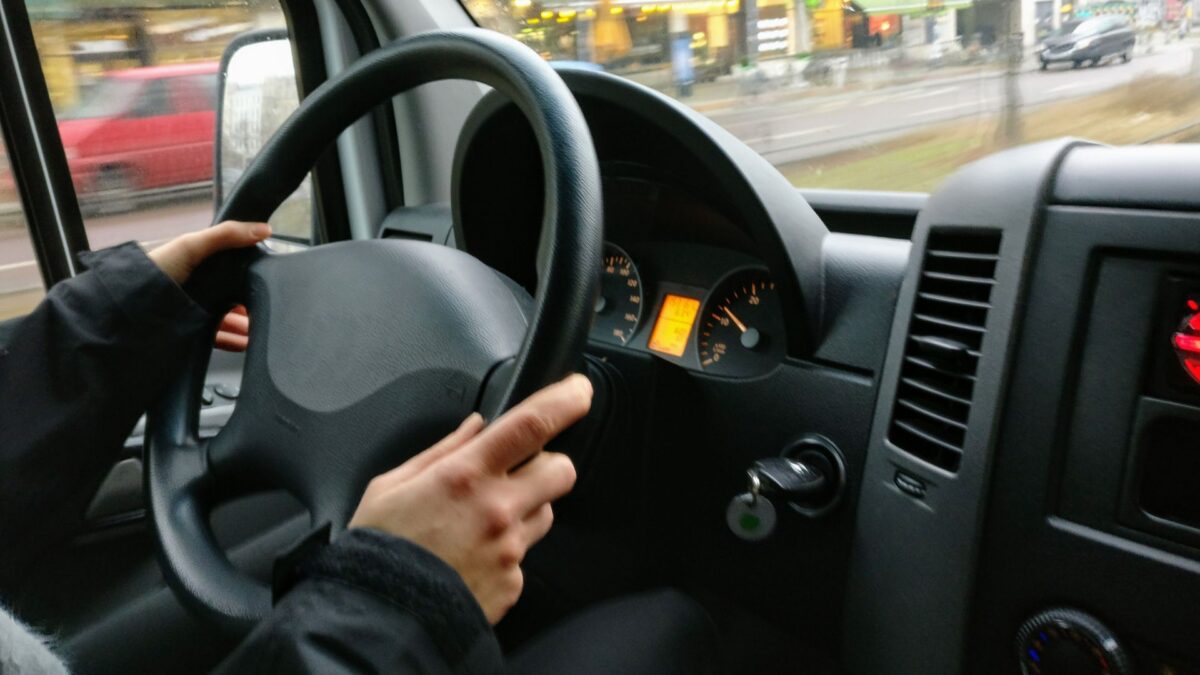 photo of someone driving a vehicle taken from inside the cab