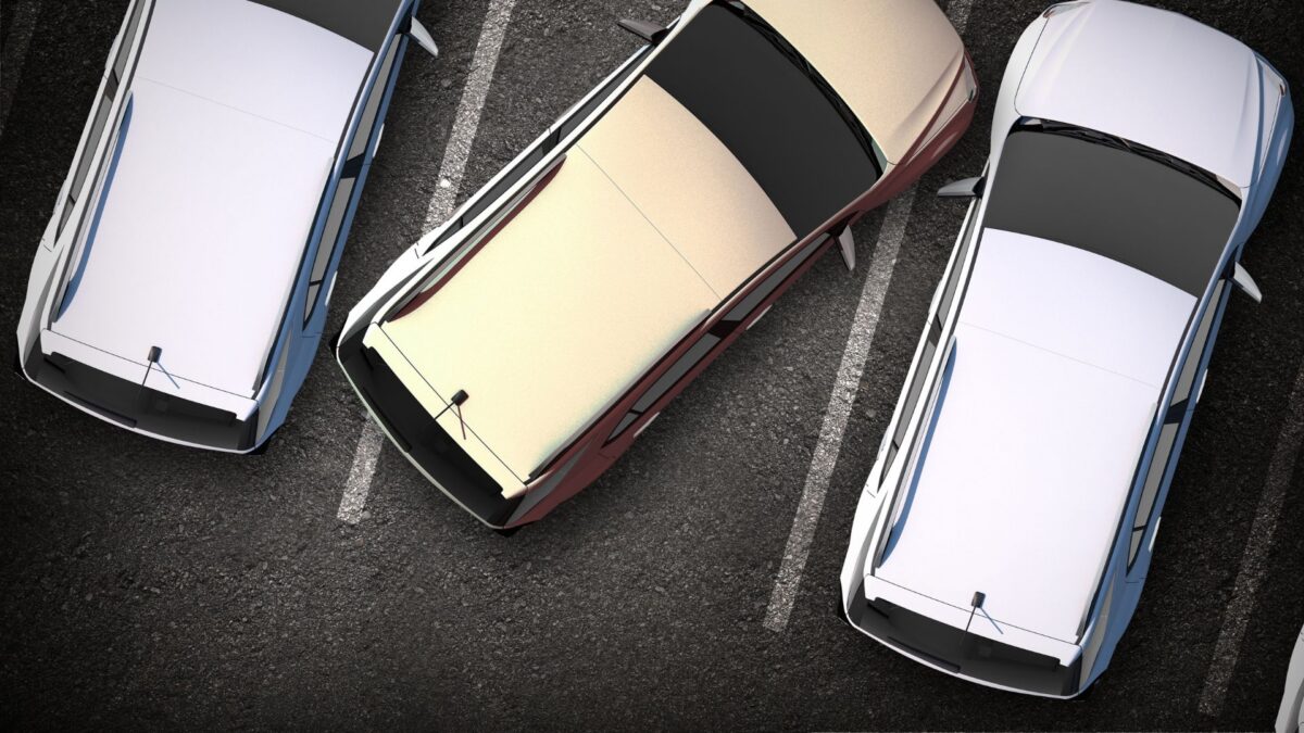top-down photo of cars badly parked in a medical plaza parking lot
