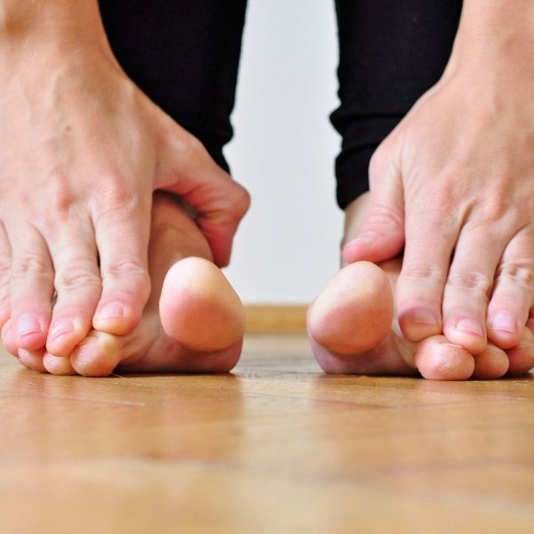 a man touching his toes a man touching his toes
