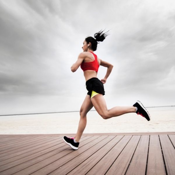 a woman running after having her bunions treated by a podiatrist a woman running after having her bunions treated by a podiatrist