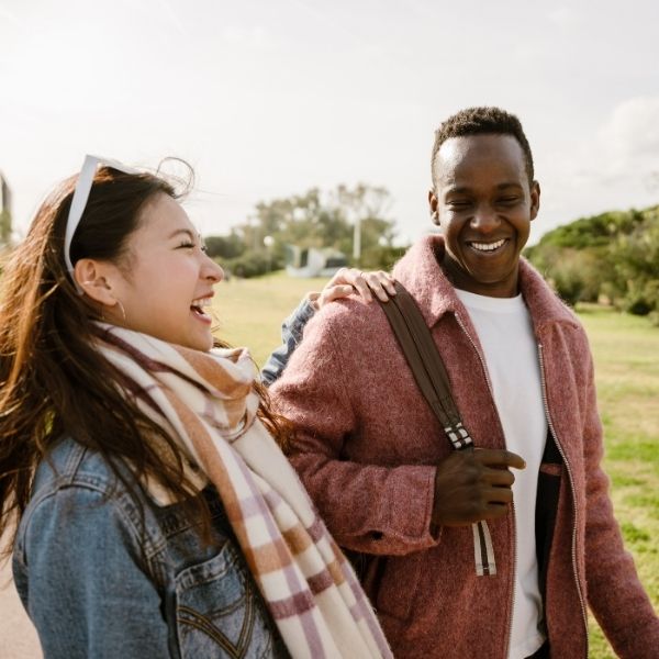 photo of a man and woman laughing photo of a man and woman laughing