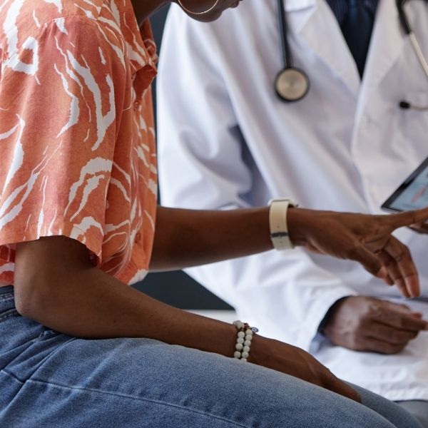 photo of a podiatrist consulting with a patient