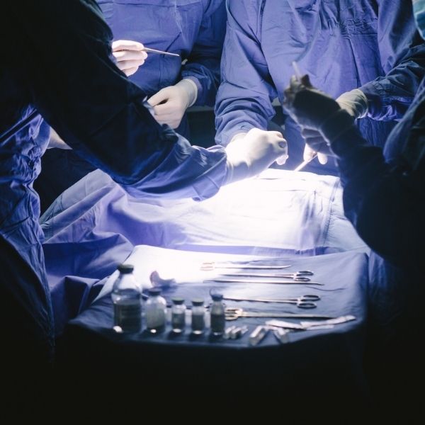 podiatric surgeons performing a minimally invasive procedure on a bunion podiatric surgeons performing a minimally invasive procedure on a bunion